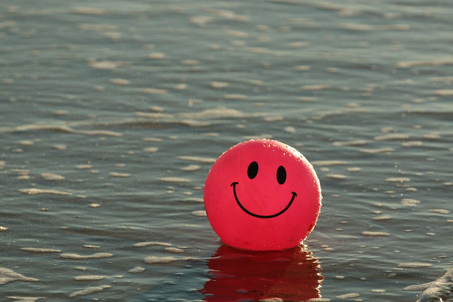 red, emoji balloon, sea, daytime, ball, beach, happy, ocean, pink, smile