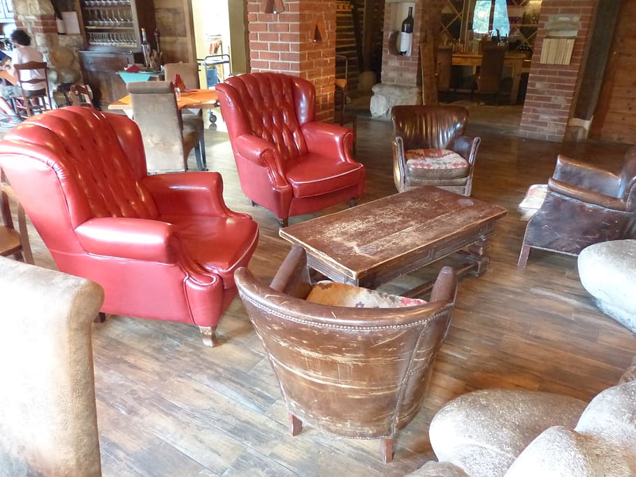 rectangular, brown, wooden, center table, two, red, quilted, leather wing chairs, Seating, Area