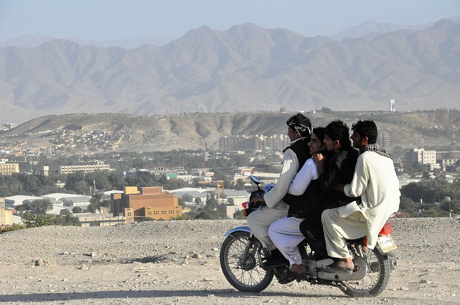 four, men, riding, motorcycle, dirt road, moped, handlebars, too much, kabul, afghanistan