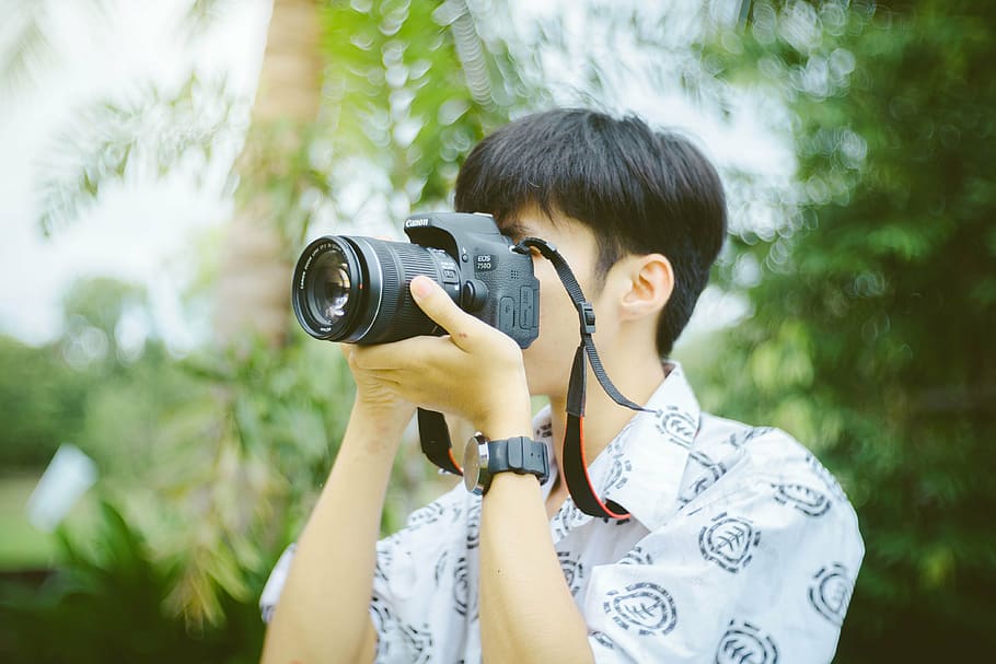 man, holding, dslr camera, taking, shot, daytime, camera, lens, accessory, photography