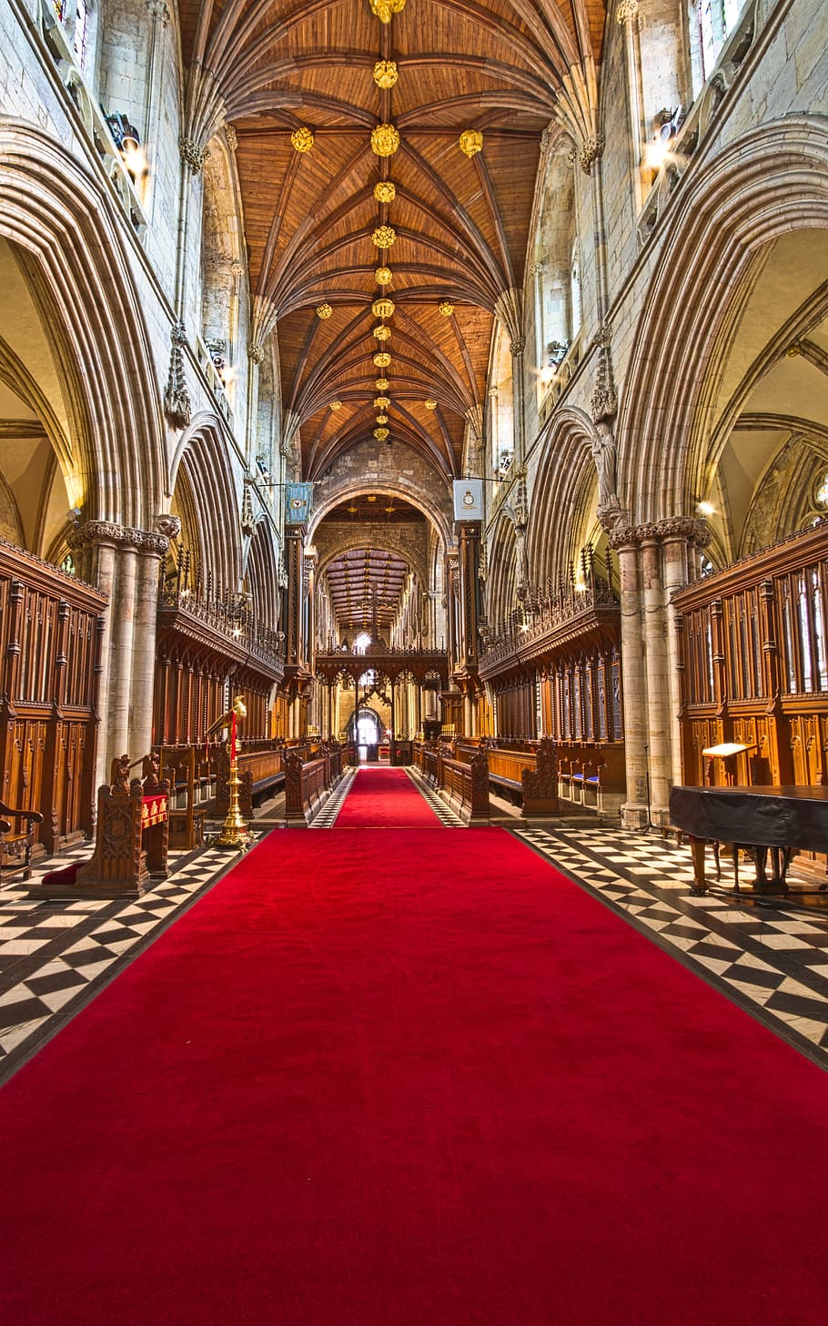 red, carpet, inside, brown, hallway, architecture, building, infrastructure, cathedral, indoors