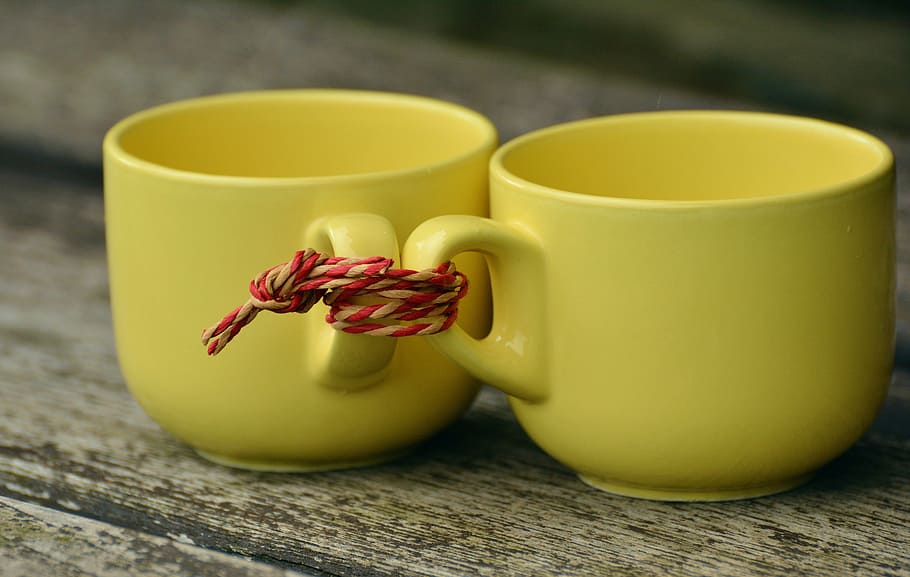 two, yellow, ceramic, teacups, tied, together, t, for two, partnership, pull together