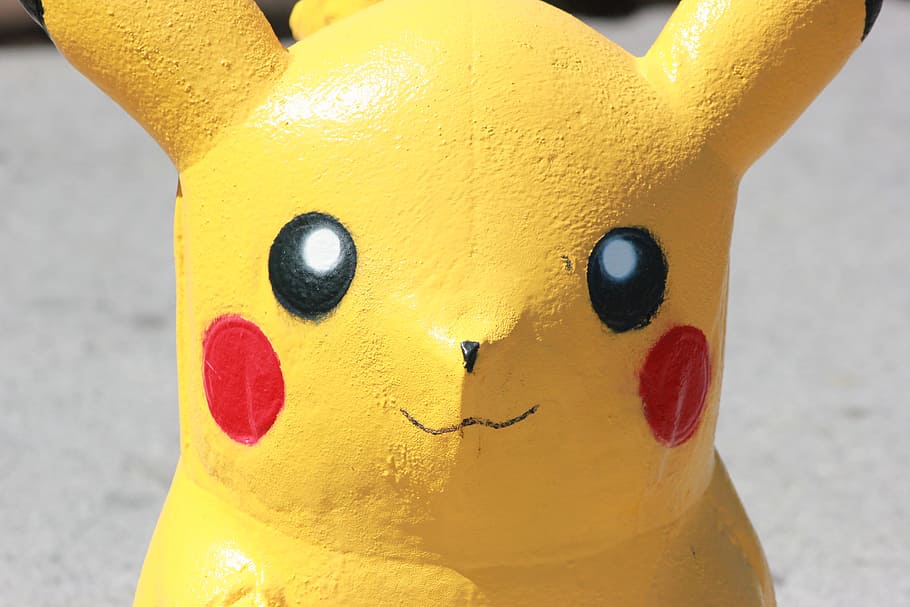 pokemon pikachu figurine, pokemon, pikachu, statue, art, yellow, representation, close-up, toy, focus on foreground