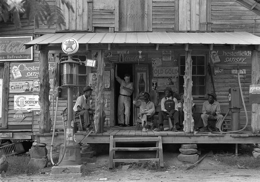 grayscale photo, people, sitting, outside, hub, vintage, north carolina, country, store, black and white