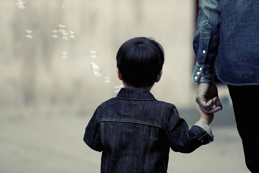 selective, focus photography, boy, holding, hand, mother, denim, jacket, walking, person