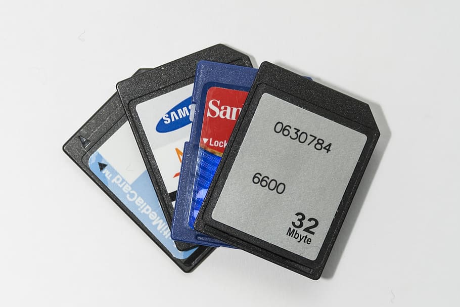 close-up photo, four, white, black, blue, sd cards, memory cards, memory stick, media, external