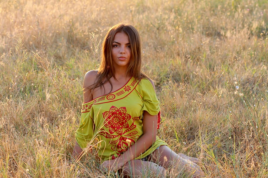 selective, focus photo, woman, sitting, brown, grass, daytime, girl, nature, in the evening