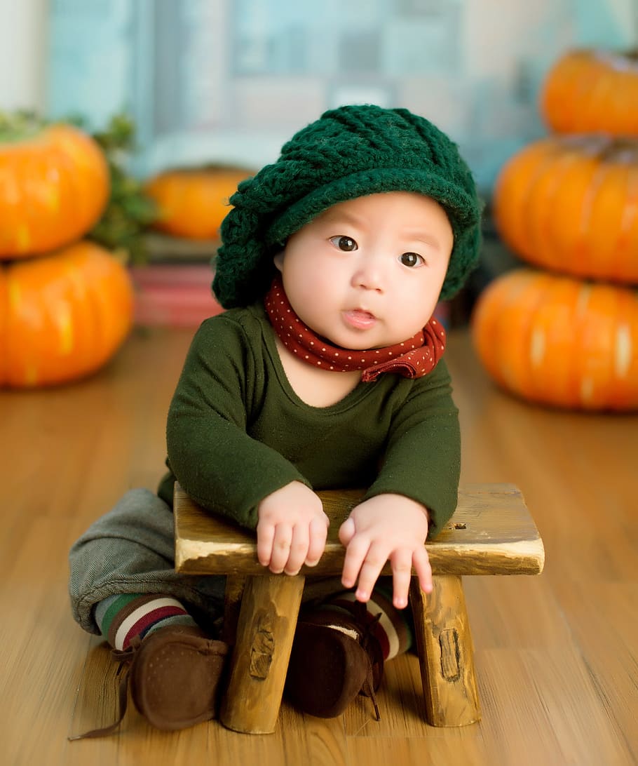 baby, wearing, green, knitted, cap, crew-neck, long-sleeved, shirt, brown, pants
