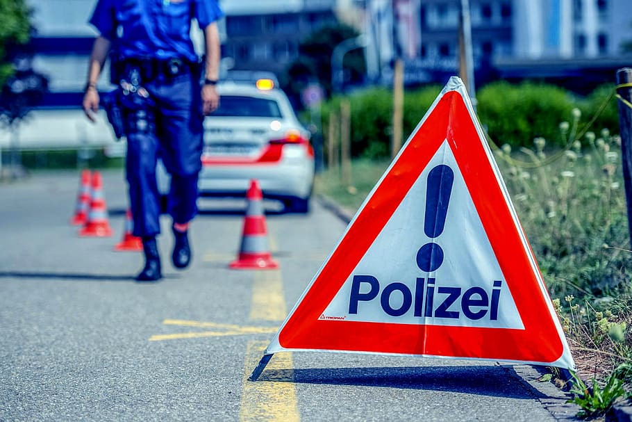 zurich cantonal police, cop, zurich, police, police uniform, road, sign, communication, warning sign, city