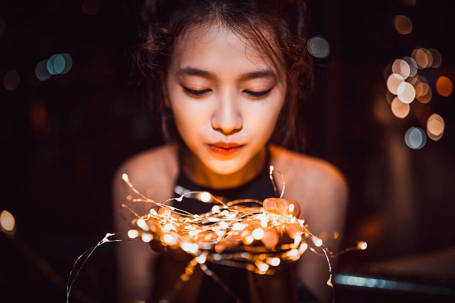 shallow, focus photography, woman, holding, string lights, girl, night, portrait, light, led