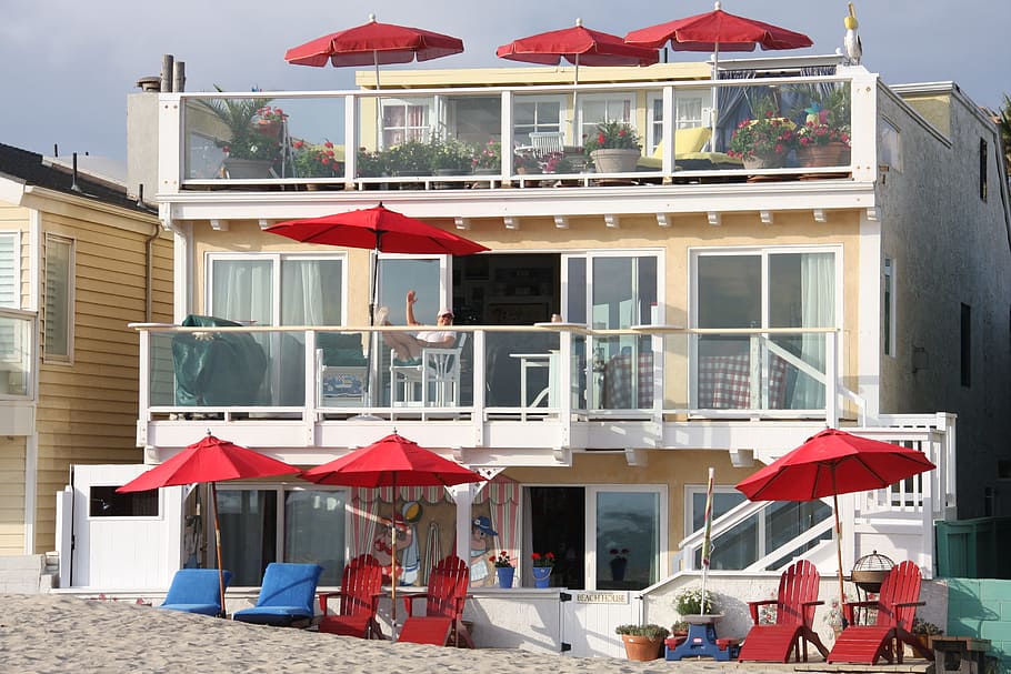 beach house, red umbrellas, three story, vacation, building exterior, built structure, architecture, building, day, city