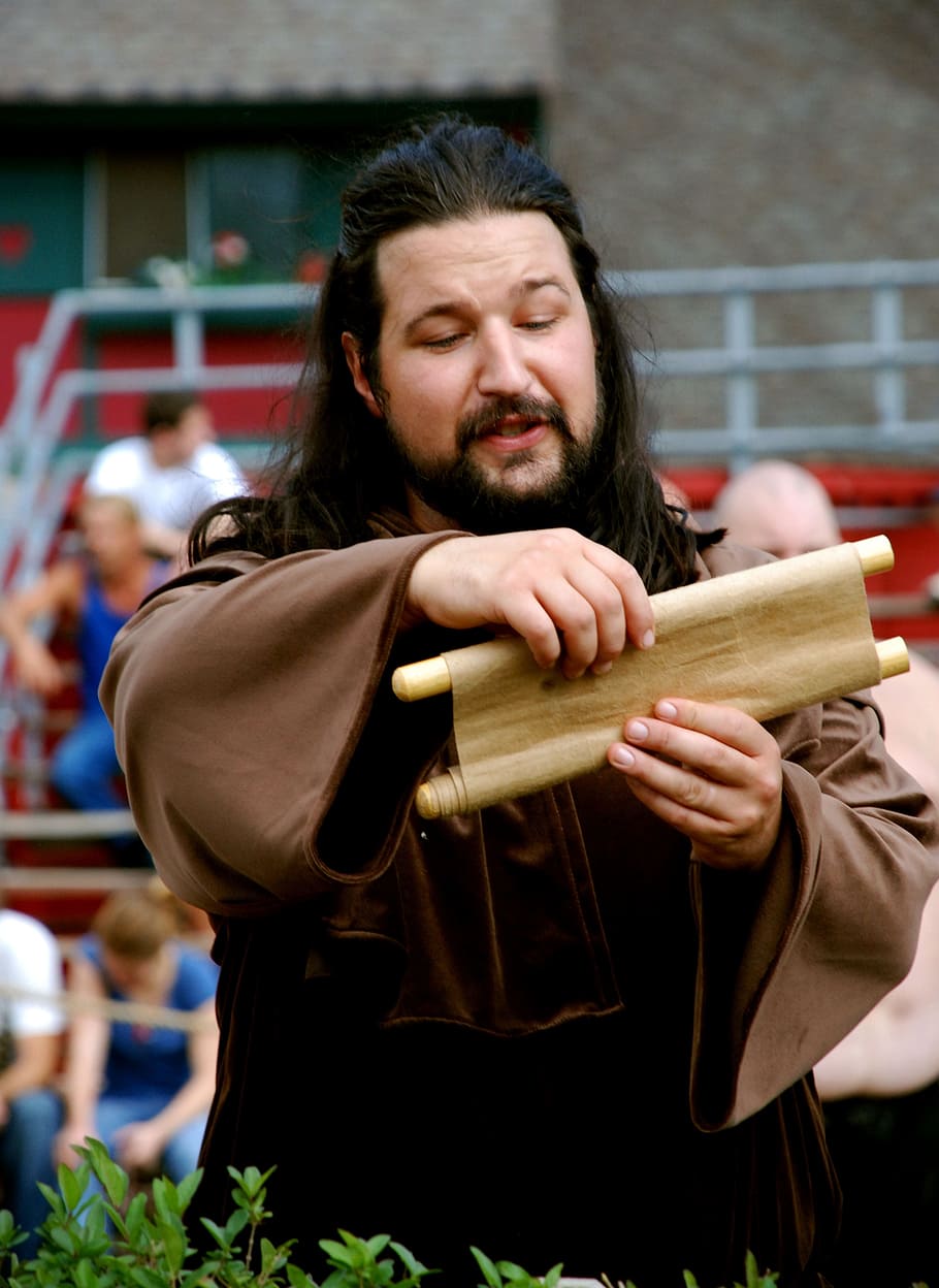 man reading script, harold, bearded, scroll, costume, medieval, renaissance, waist up, beard, one person