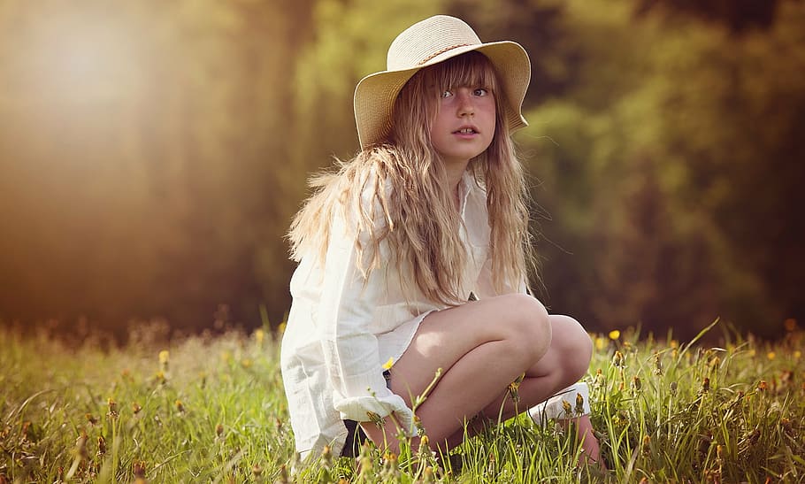 girl, sitting, green, grass, surrounded, leafed, trees, person, human, blond
