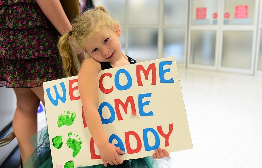 girl, holding, welcome, home daddy signage, family, love, father, daughter, military, young