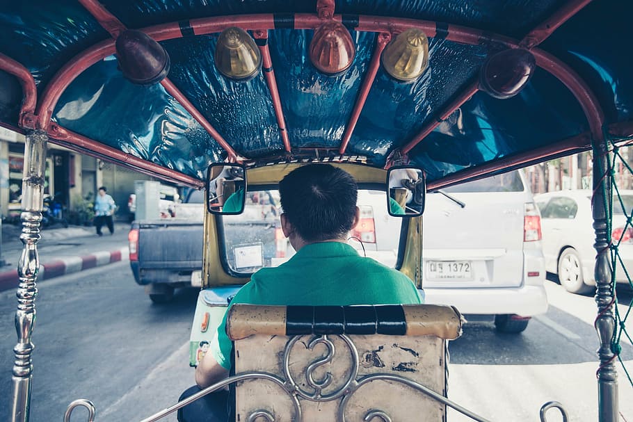 person driving autorickshaw, man, guy, vehicle, back, transportation, cars, road, mirror, driving