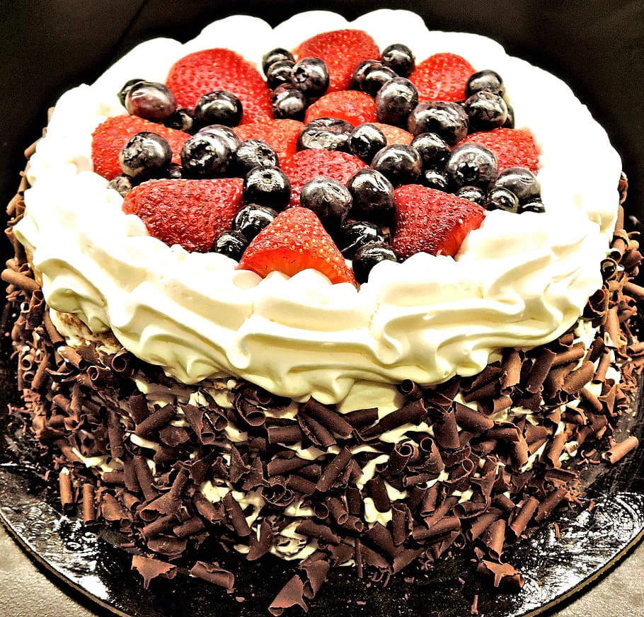 chocolate cake, strawberry, blueberry toppings, chocolate layer cake, chocolate shavings, strawberries, blueberries, whipped cream, food, food and drink