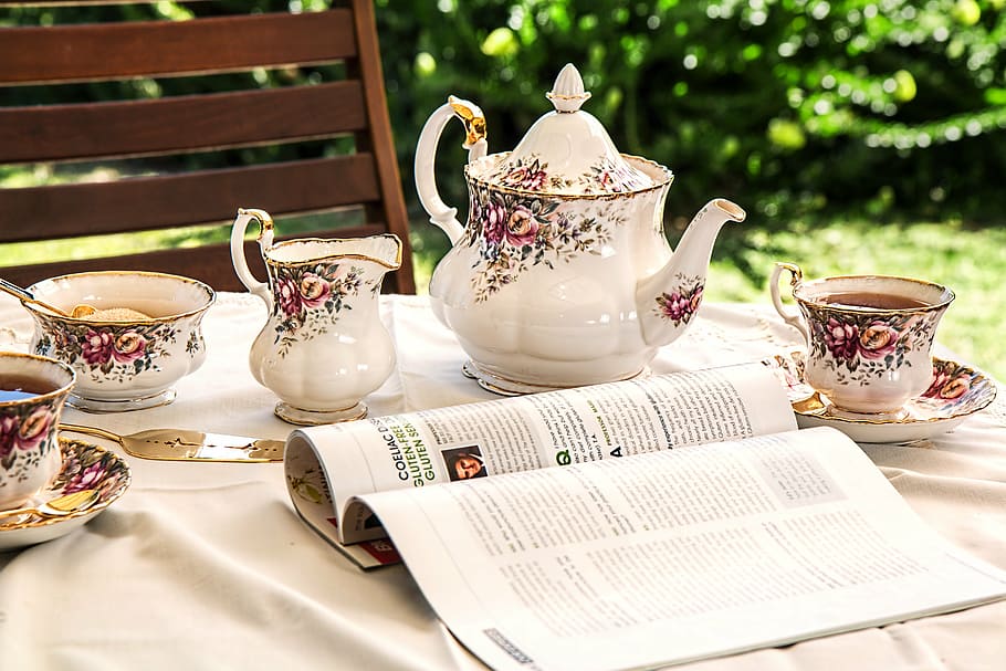 open, magazine, white-and-pink, floral, tea, set, top, table, tea time, teapot