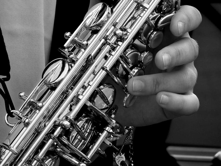 grayscale photography, person, playing, saxophone, music, instrument, musical instrument, wind instrument, brass instrument, analog