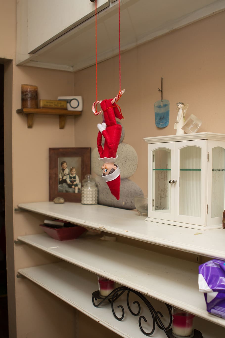 red elf doll, elf on shelf, christmas, holiday, indoors, domestic room, home interior, shelf, domestic life, representation