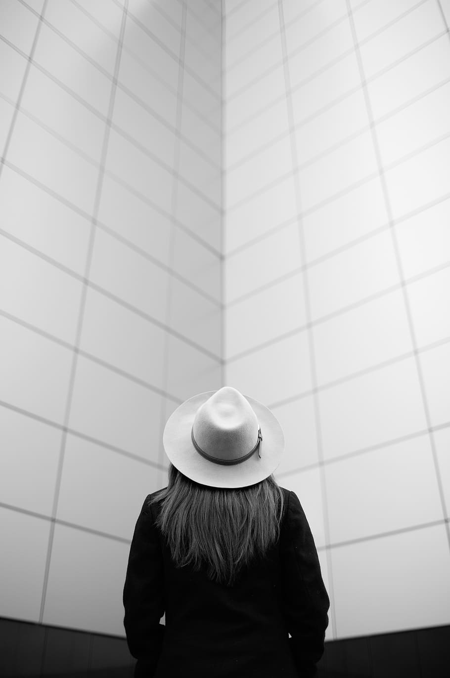black and white, people, girl, hat, alone, wall, one person, real people, rear view, lifestyles