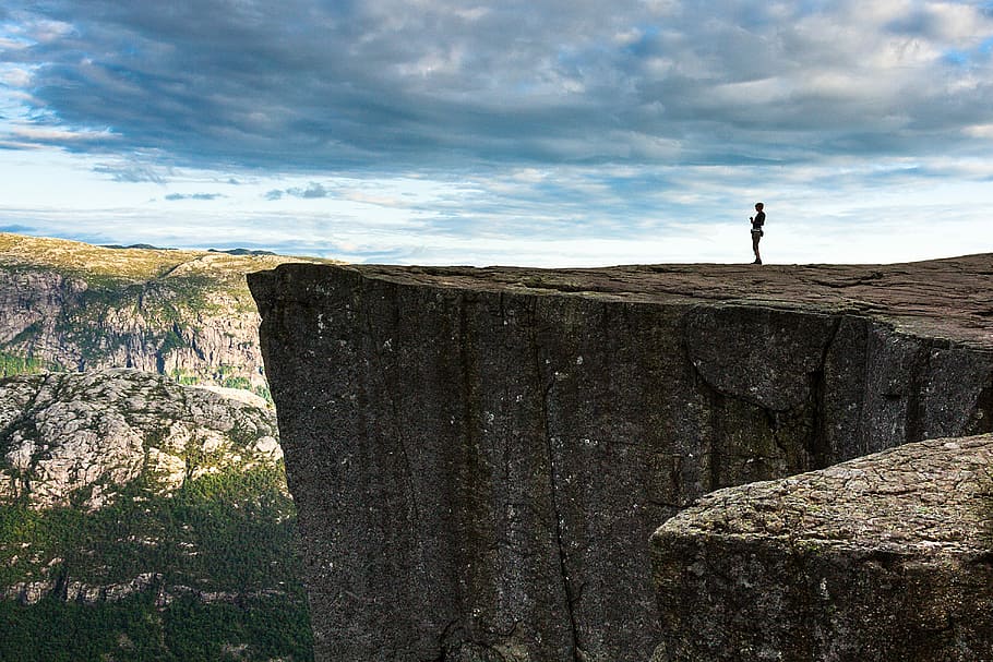 person, standing, cliff, travel, nature, panoramic, outdoors, landscape, preikestolen, norway