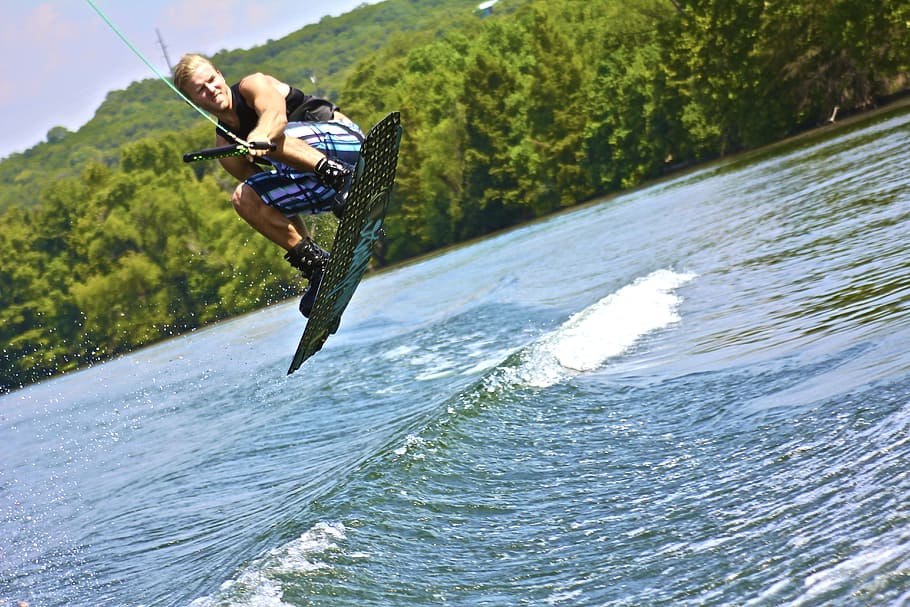 man wakeboarding, daytime, wakeboard, water sports, wake boarding, lake, boat, water, outside, sports