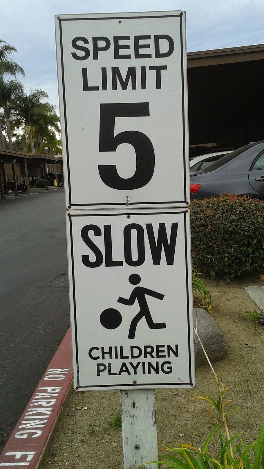 sign, speed limit, slow children playing, communication, text, western script, information, number, information sign, day