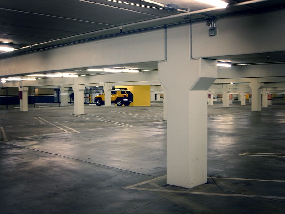 yellow, toyota fj cruiser, parked, underground, parking lot, parking deck, basement garage, subterranean garage, underground parking, underground garage