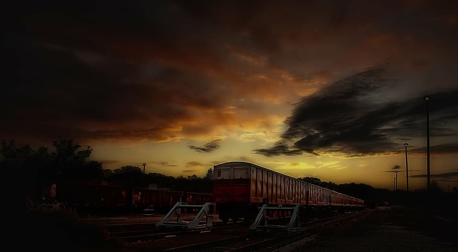 timelapse photo, train, silhouette trees, siding, night, railroad Track, cloud - sky, sky, sunset, architecture