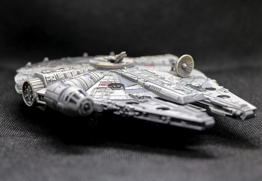spaceship, millennium falcon, toy, still life, selective focus, finance, currency, paper currency, indoors, table