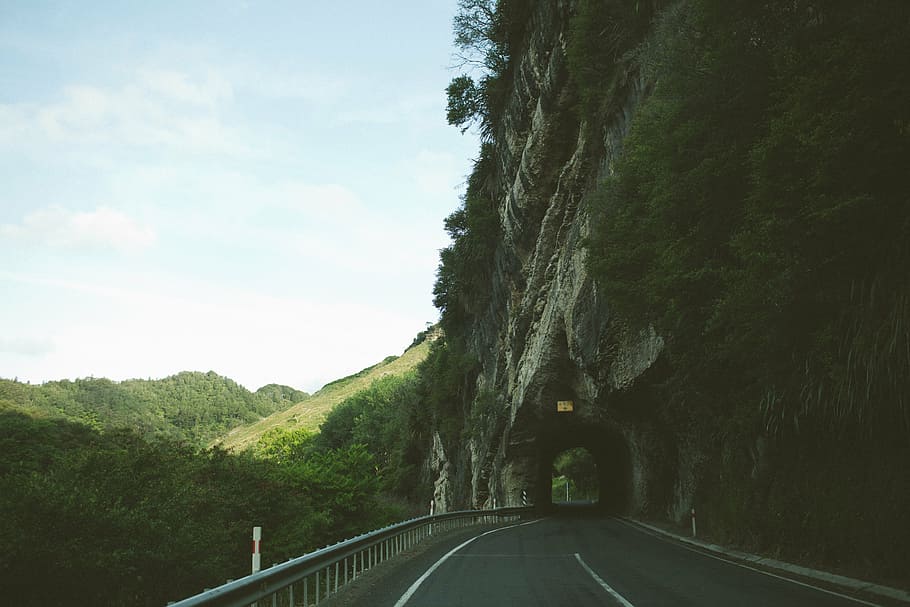 gray, concrete, road midst tunnel, asphalt, road, leading, tunnel, sky, winding, hills