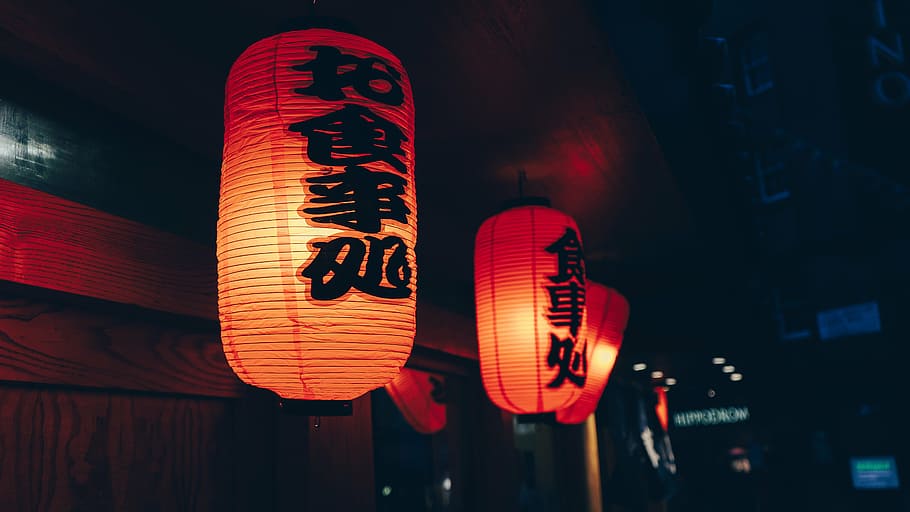 selective, focus photography, three, red, candle lanterns, hanged, door front, dark, night, building
