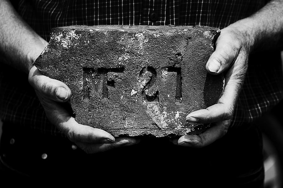 grayscale photography, person, holding, concrete, brick, body weight, heritage, the hands, the number of the, black