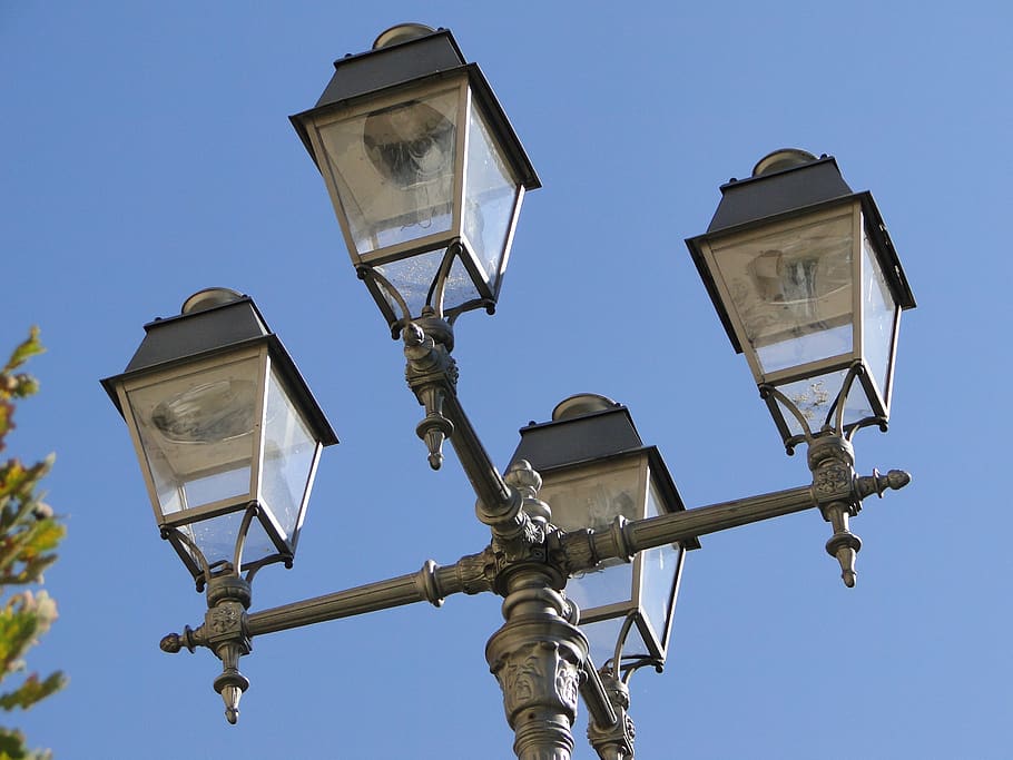 the street lamp post, lamppost, reflector, lit, lighting equipment, low angle view, street light, street, sky, nature