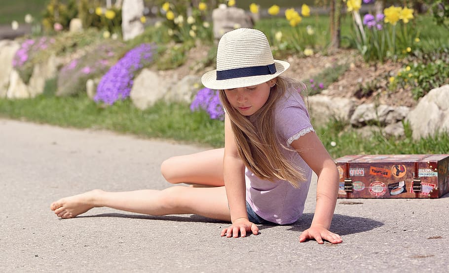 girl, sitting, floor, human, person, child, ground, road, asphalt, hat