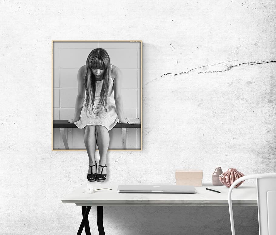 greyscale woman sittng, shelf painting, desk, woman, office, worried, girl, wait, sit, think