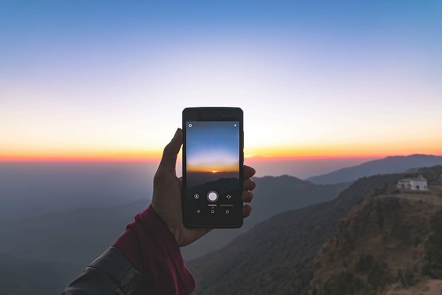 man, taking, sun rise, using, smartphone, cellphone, mobile, touchscreen, hand, mountains
