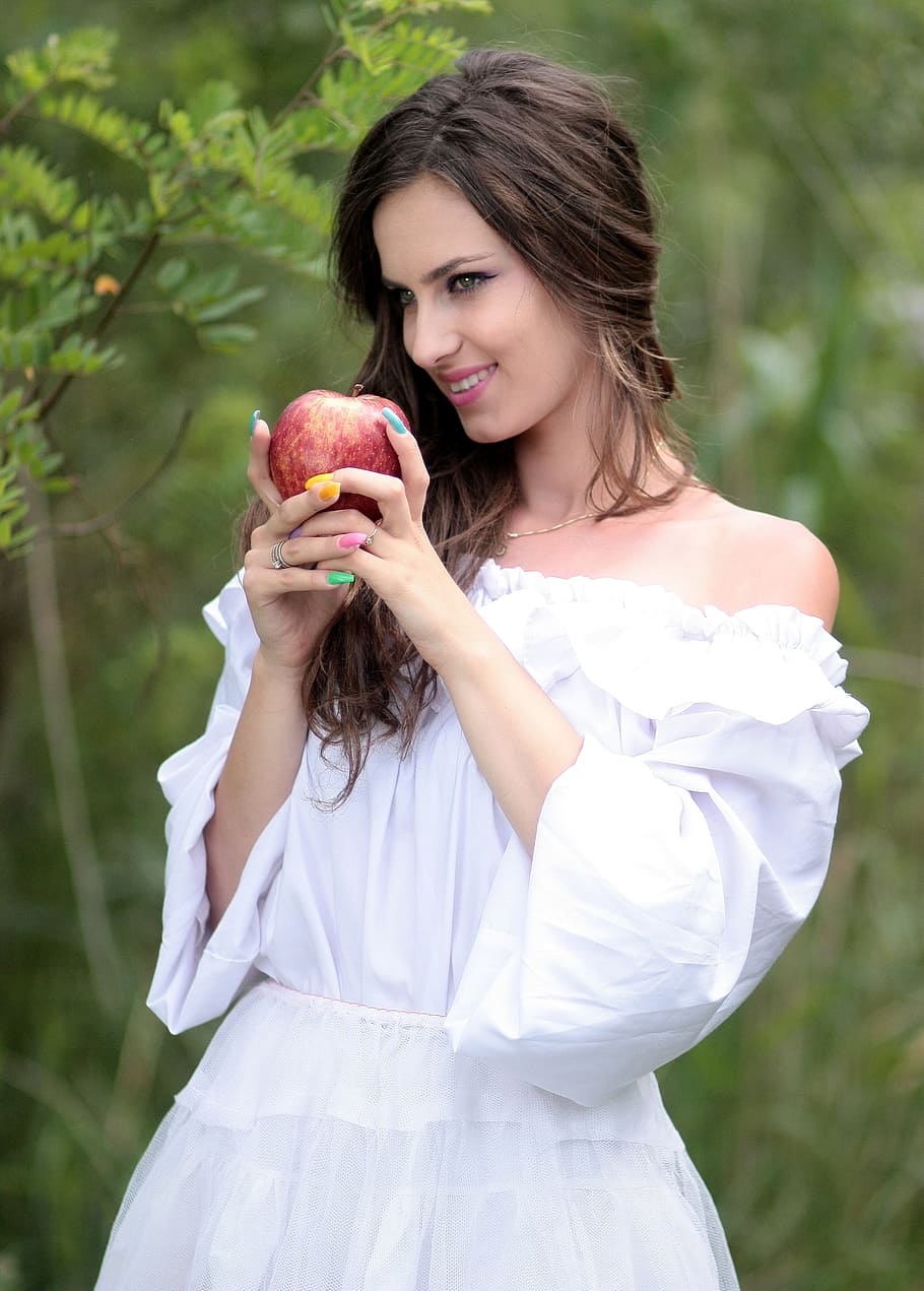 woman, wearing, white, strapless elbow-sleeved dress, holding, honeycrisp apple, girl, march, snow white, forest