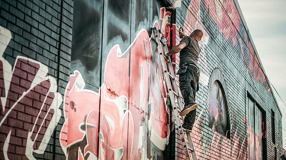 man spraying paint, wall, graffiti, artist, graffiti art, culture, graffiti wall, lifestyle, outdoors, street