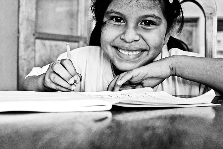 girl holding pen, student, school, learn, education, learning, girl, classroom, elementary, study