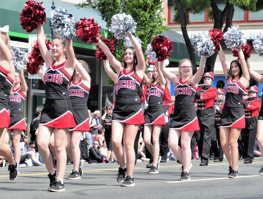 cheerleader women dancing, road, daytime, parade, cheerleaders, pumpkins, merry, legs, summer, mini skirt