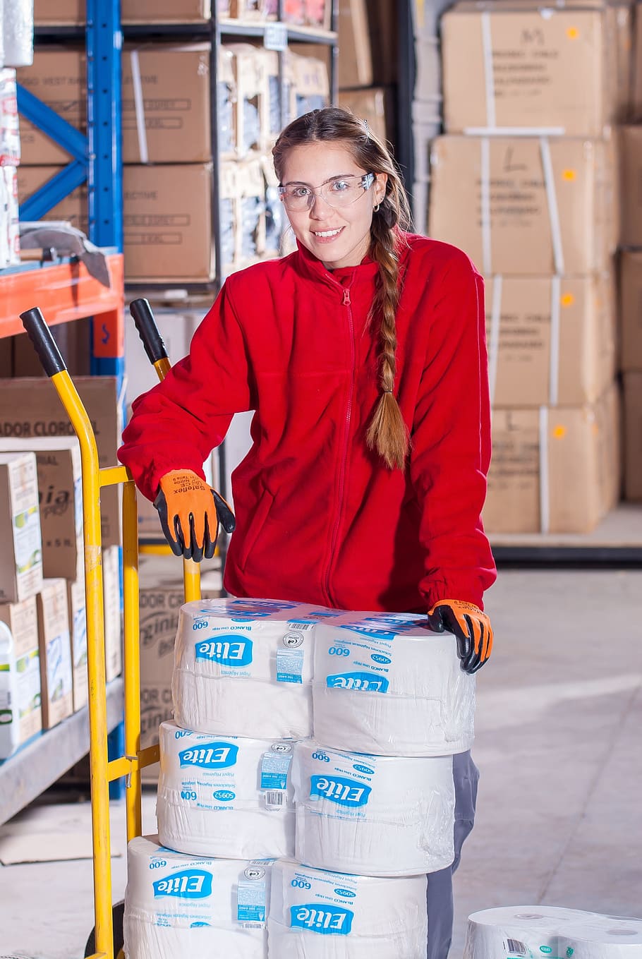 woman, yellow, hand truck, industrial, security, logistic, work clothes, industrial safety, protective goggles, vest