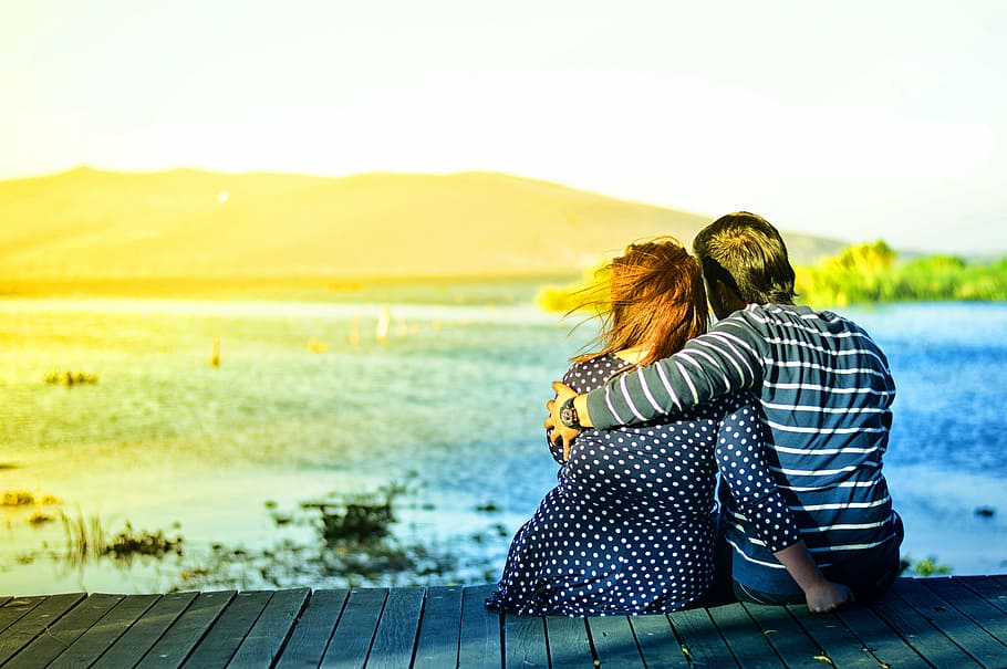 man, woman, sitting, wooden, surface, daytime, couple, seaside, looking, view