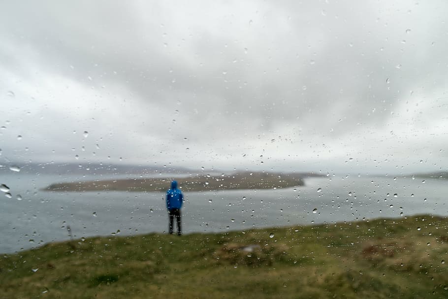man, standing, green, grass, body, water, rainy, day, sea, island