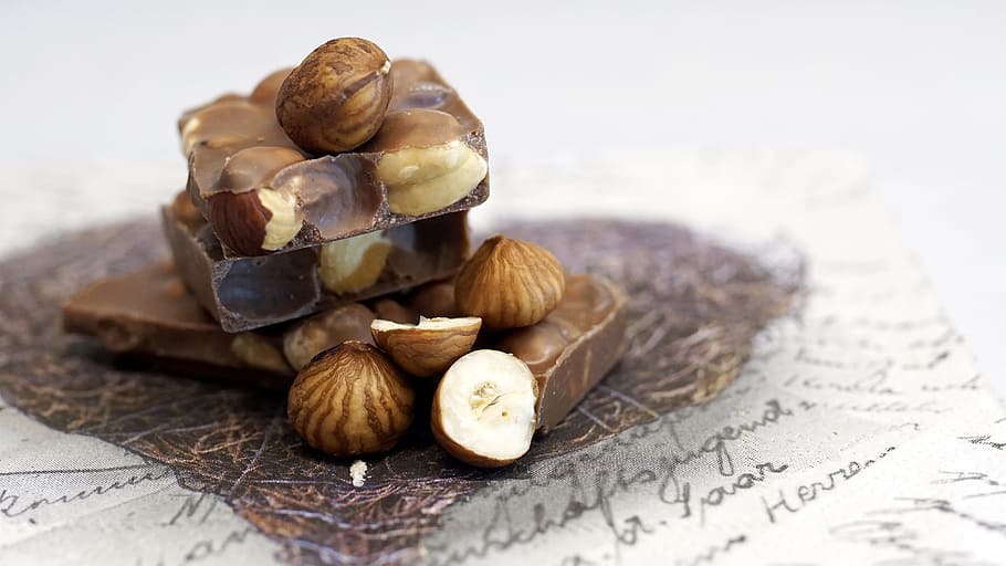 stack of peanuts, chocolate, hazelnut chocolate, sweet, delicious, candy, nibble, chocolate bar, nuts, vollmilch
