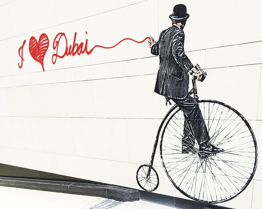man, riding, bicycle wall painting, dubai, city walk, graffiti, bicycle, transportation, cycling, text