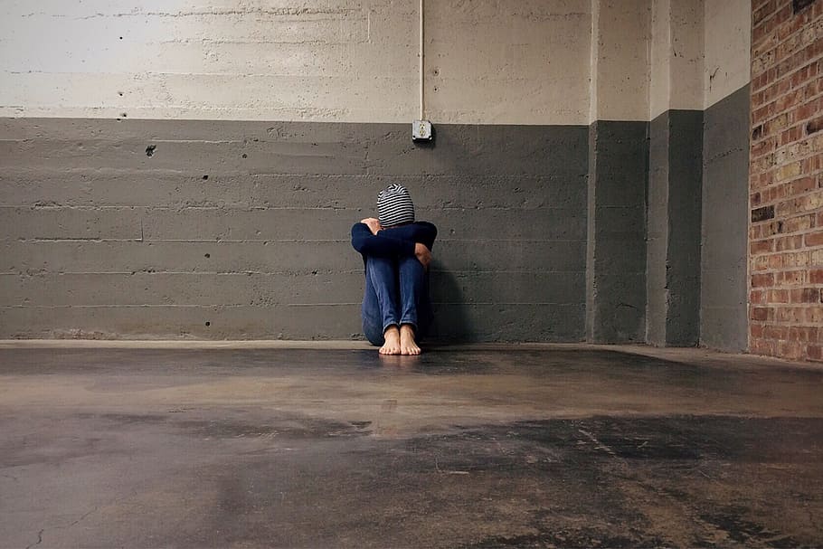 person, sitting, gray, wall, homeless, bullied, hiding, alone, sadness, male