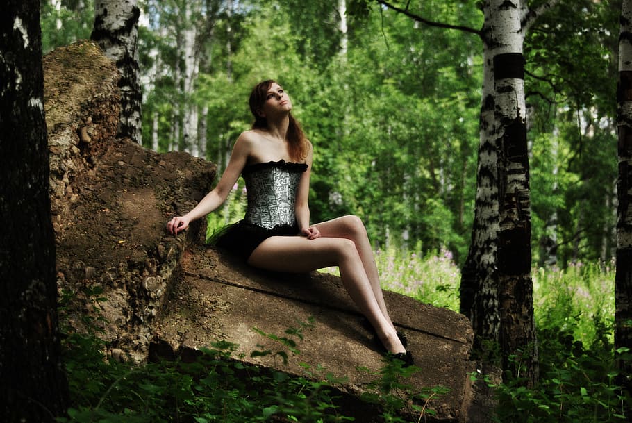 fabulous girl, on the stone, sitting, in a corset, birch, grove, greens, grass, trees, nature