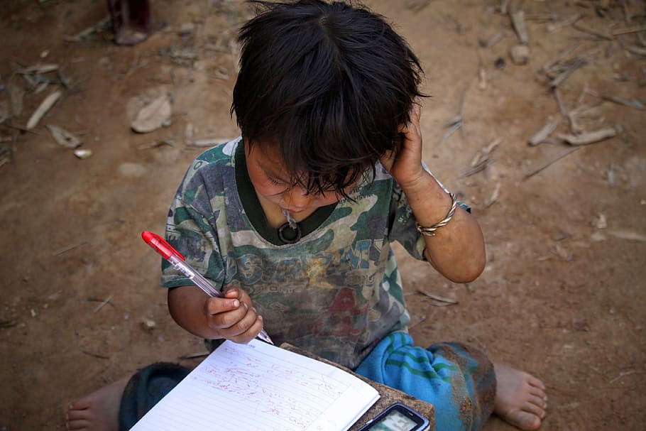 boy, holding, red, pen, looking, white, notebook, kid, child, writing