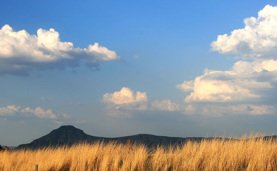 sky, clouds, mountain, grass, ochre, landscape, cloud - sky, beauty in nature, scenics - nature, environment